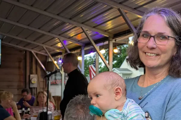 mother and her baby at theology on tap event in maryville il
